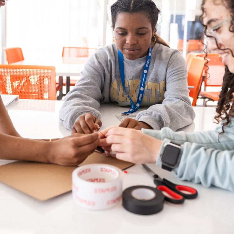 3 girls work together on a design challenge.