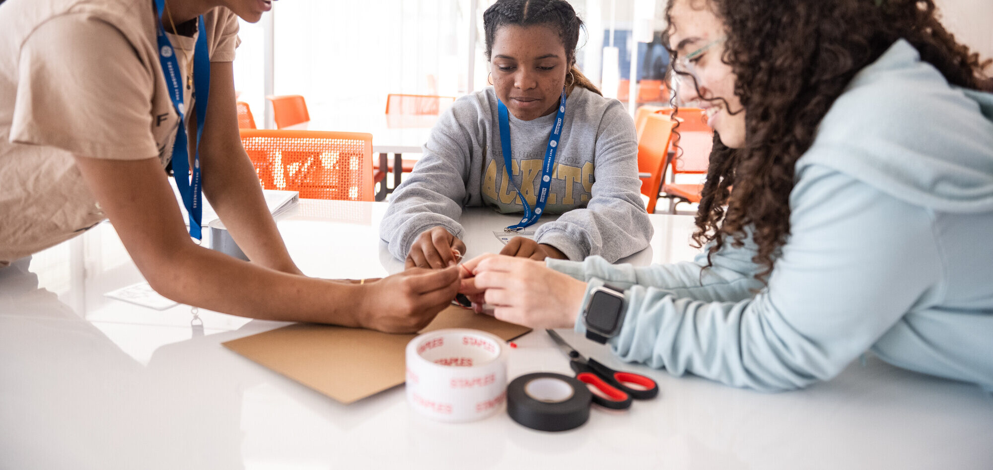 3 girls work together on a design challenge.