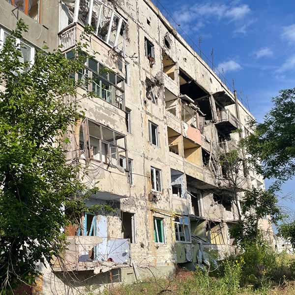 A war-ravaged concrete building in Ukraine
