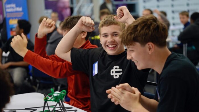 A student celebrates a win.