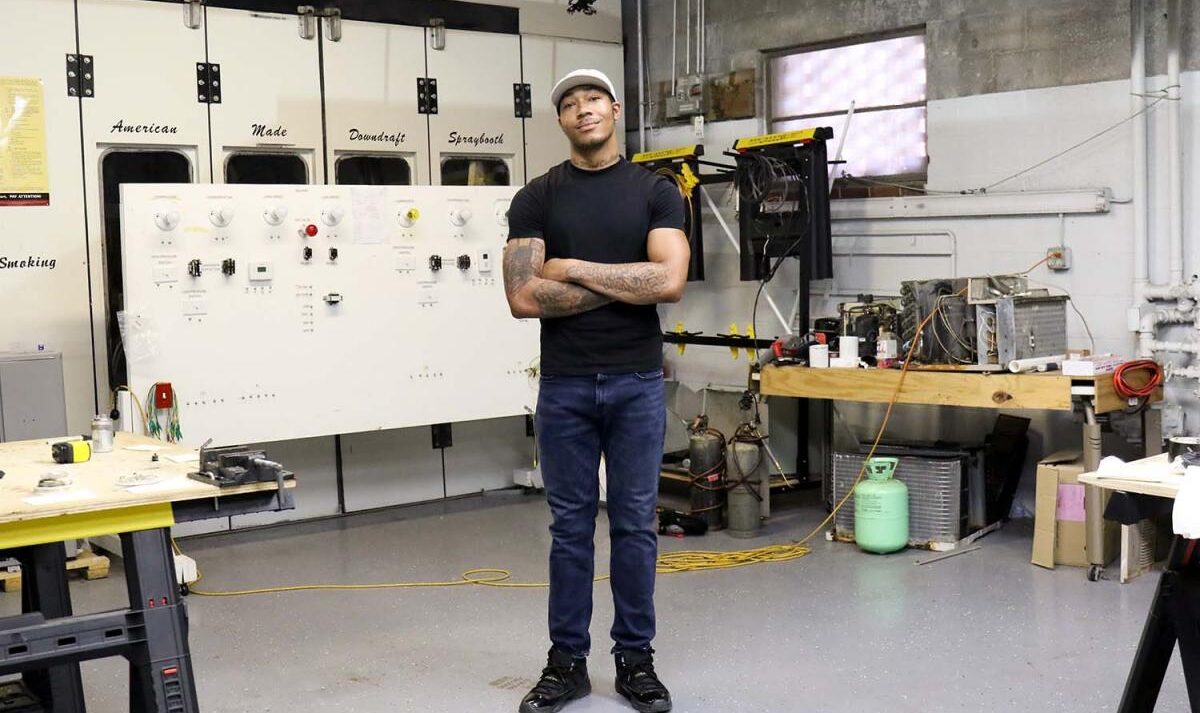 Kani Jones standing in the middle of the HVAC/R workshop