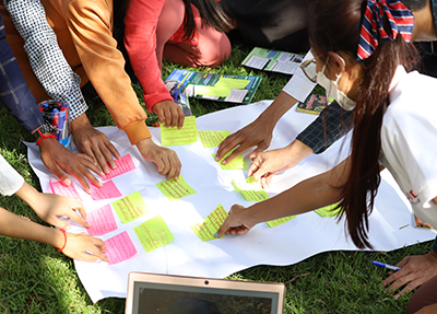Green Group members brainstorm ideas for how to lead climate action activities. “We come up with ideas [and] solutions,” says Green Group member Pichpheary Nann. Photo credit: Maly Phou/FHI 360