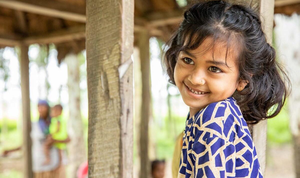 A young girl smiling
