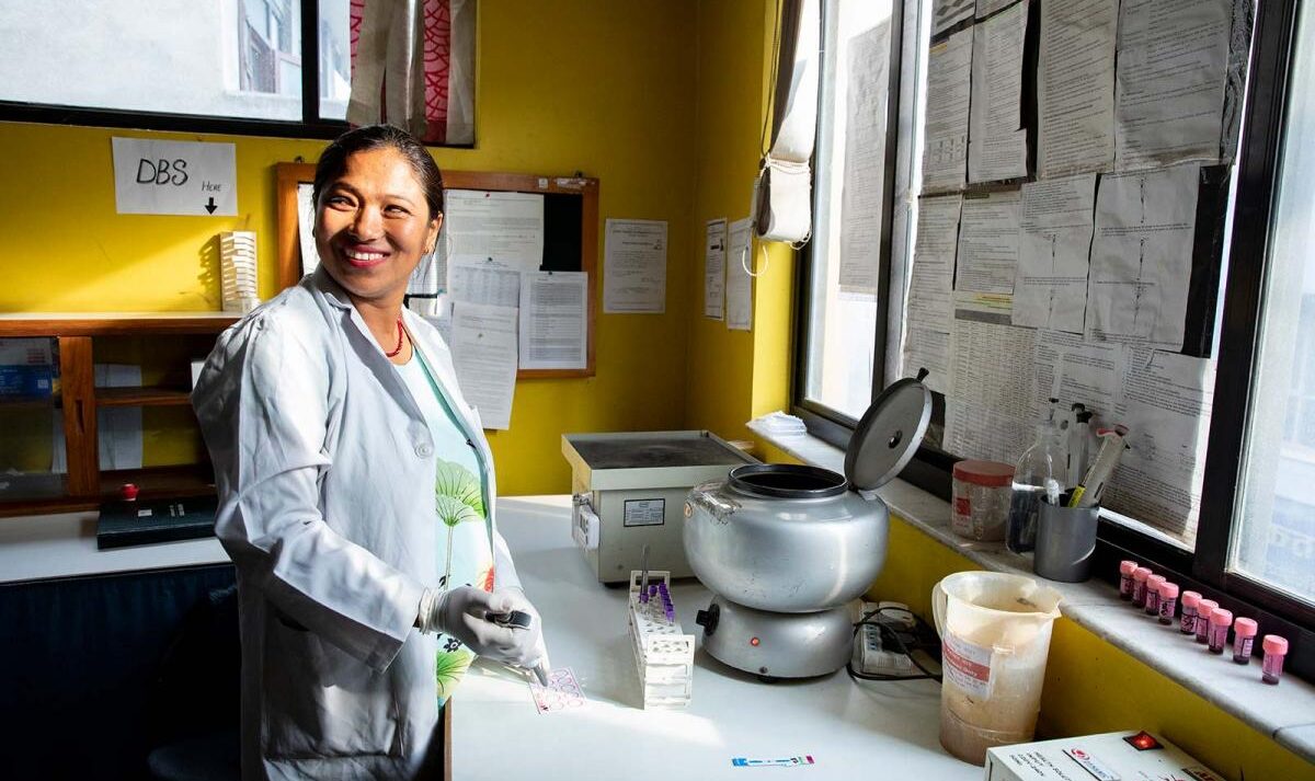 Woman in a lab in Kathmandu testing blood samples