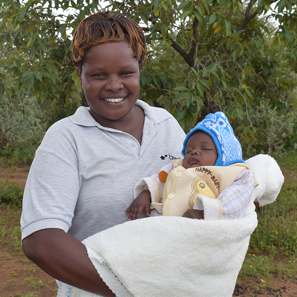 woman with baby smiling