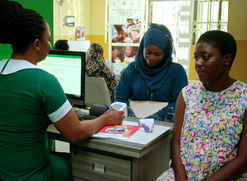women in clinic acting around maternal health care.