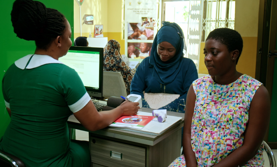 women in clinic acting around maternal health care.