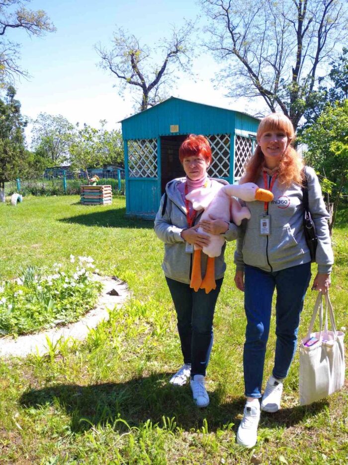 Olena Smyrnova (left) and Dariia Bui hold Hugging Goose and other materials for a visit to the kindergarten. Photo credit: Oksana Kozlovska