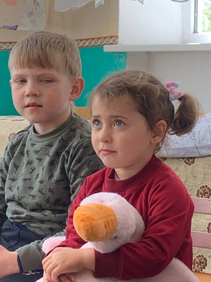A student has a turn sitting with the Hugging Goose. Photo credit: Olena Smyrnova