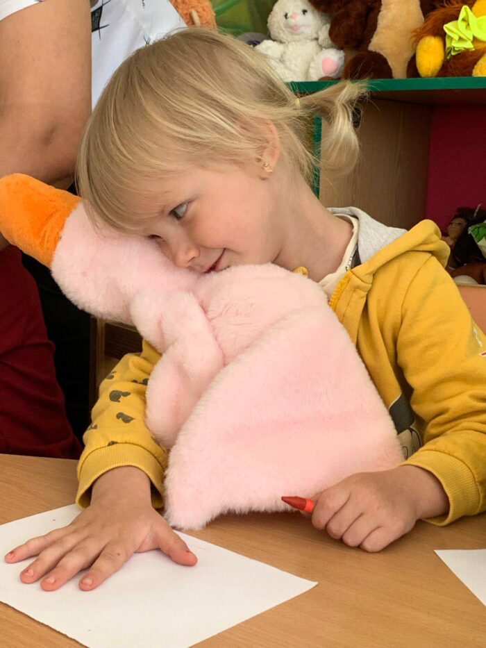 A student embraces the Hugging Goose. Photo credit: Olena Smyrnova