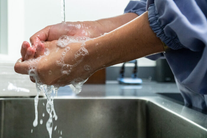 Hands being washed with soap and water