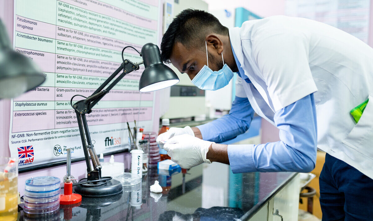 Laboratory technician examining test results