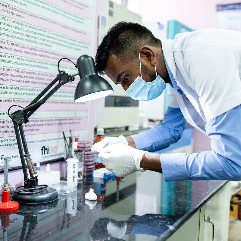 Laboratory technician examining test results