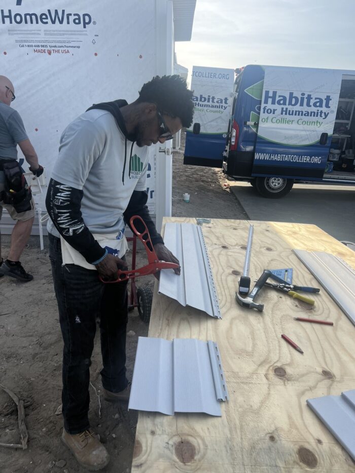Man cuts metal building materials