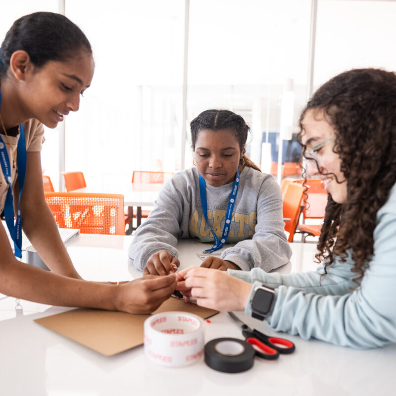 3 girls work together on a design challenge.