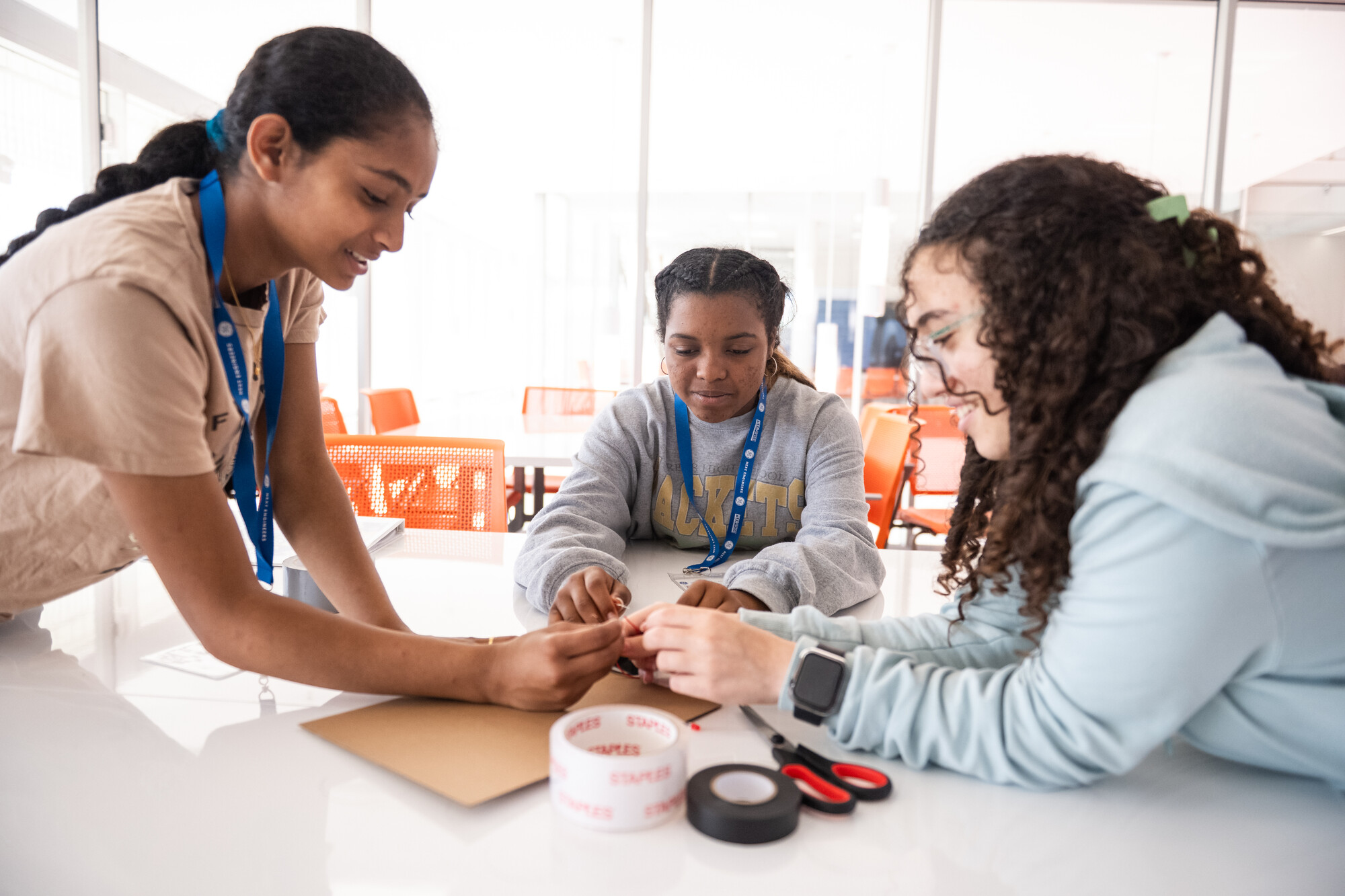 3 girls work together on a design challenge.