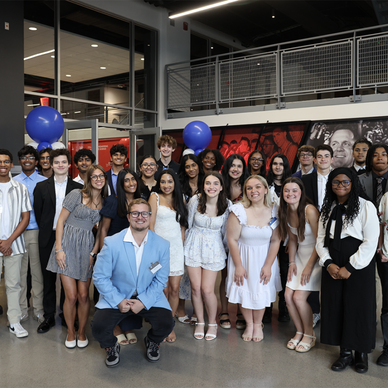 A group of academy participants during their graduation ceremony.