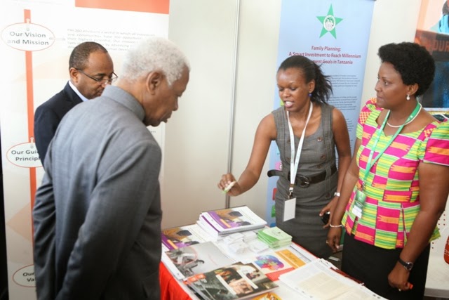 From left to right: The Honorable Dr. Hussein Mwinyi, Minister of Health and Social Welfare; The Honorable Dr. Mohamed Gharib Bilal, Vice President of the United Republic of Tanzania; Elizabeth Ndakidemi, Technical Officer, FHI 360 in Tanzania; Dordina Kadeghe, Administrative Assistant, FHI 360 in Tanzania.